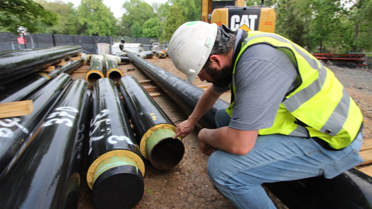 RMF Engineer inspecting steam to hot water conversion - Image 4