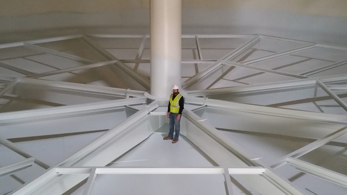 Man standing on thermal energy storage system - Image 1